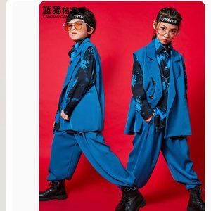 A BOY SUIT WITH BLACK DRESS SHIRT WITH BLUE BEACH FLOWERS AND DRESS PANTS